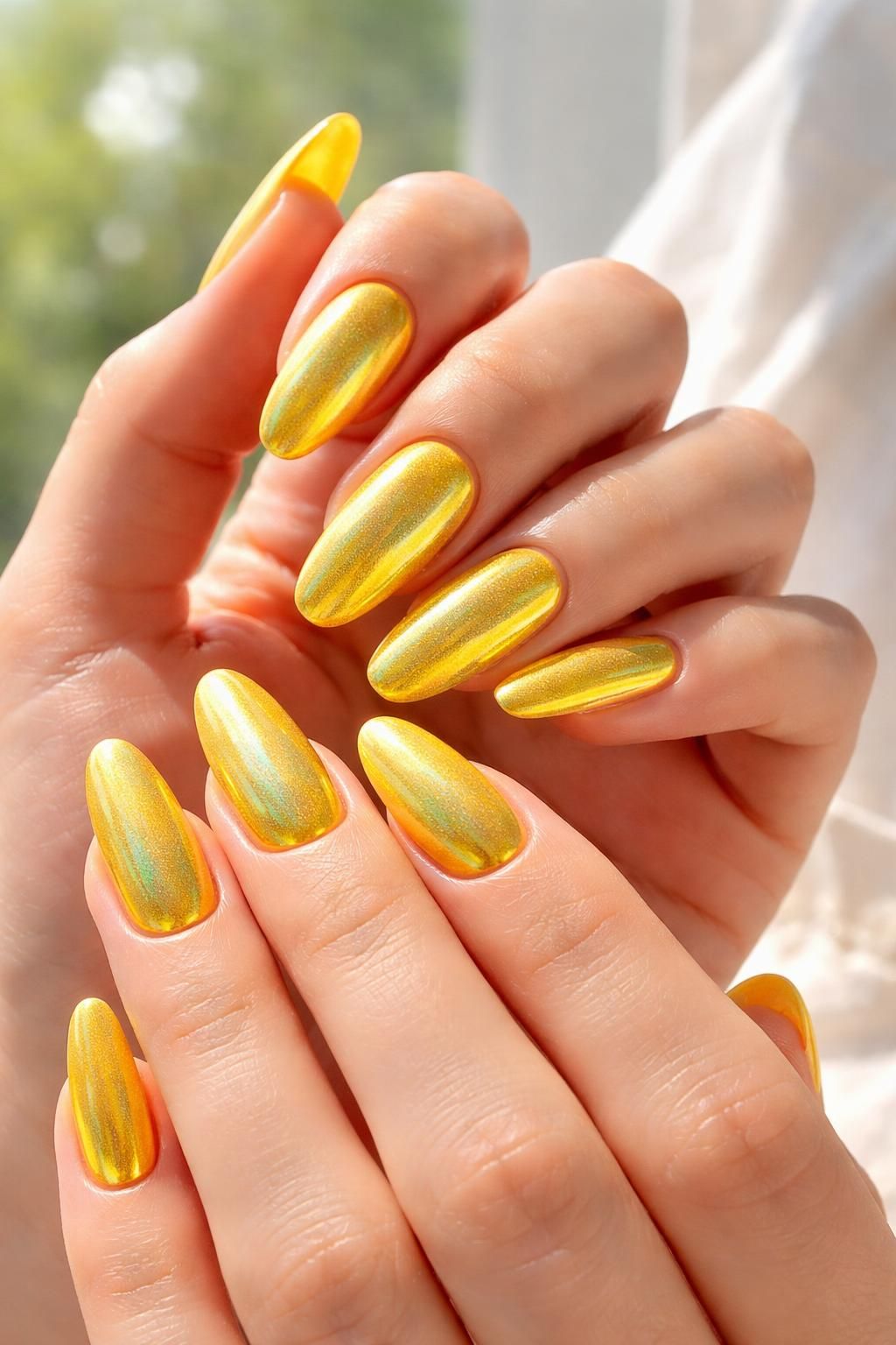 discover the bold and bright trend of shimmering chrome yellow nails, perfect for making a vibrant statement with your manicure.